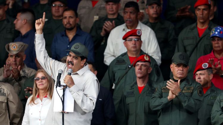 Venezuela's Maduro orders militia expansion as Guaido tours blackout-ravaged state
