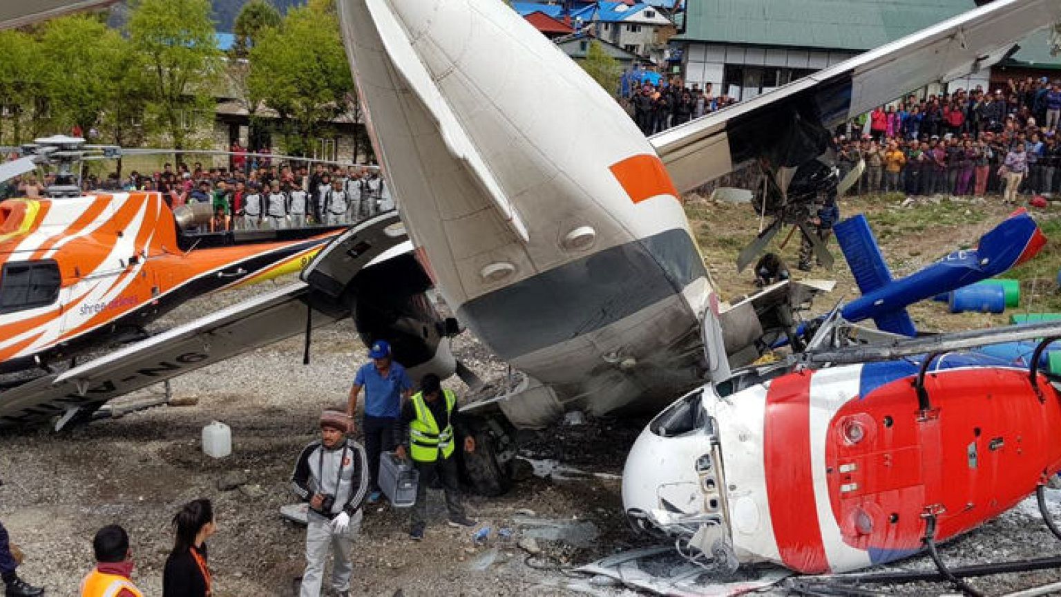 Nepal plane hits parked helicopter while taking off, killing three