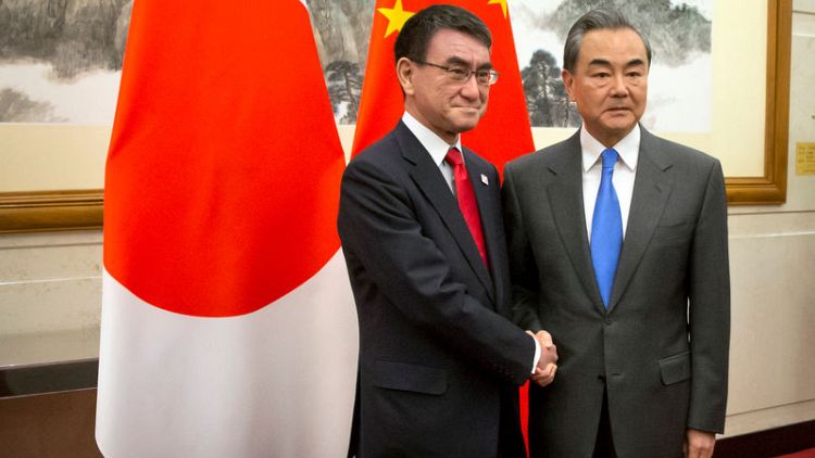 China says Japan should do more to seek cooperation, not competition