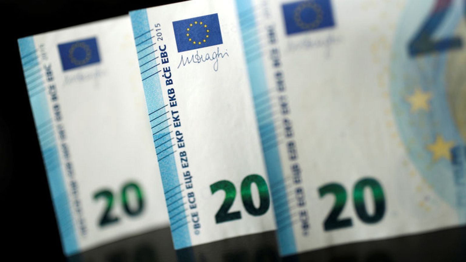 Euro buoyant on improved economic views, awaits euro zone PMI