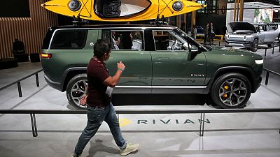 Automakers invest heavily in electric vehicles despite still-low demand Automakers invest heavily in electric vehicles despite still-low demand
