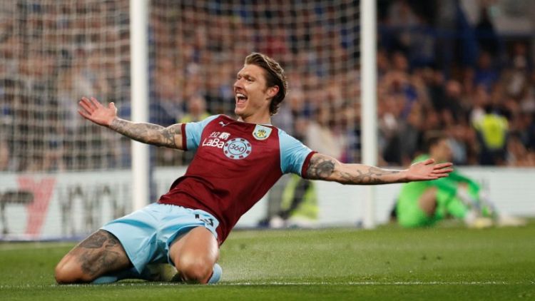 Chelsea held 2-2 by Burnley, denting Champions League hopes
