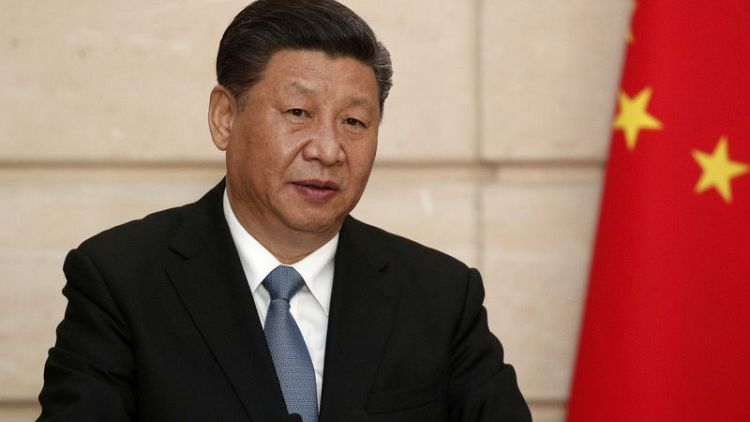 رئيس الصين يقول إن شعبه محب للسلام في افتتاح عرض كبير للقوات البحرية