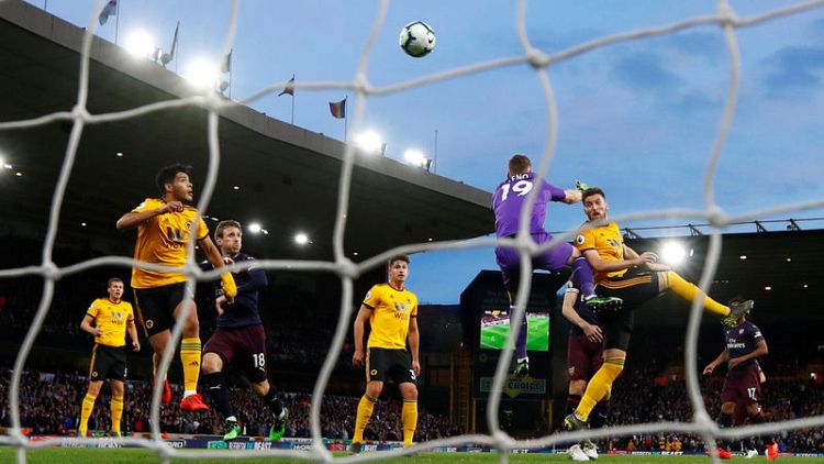 Arsenal's top-four hopes dented by defeat at Wolves