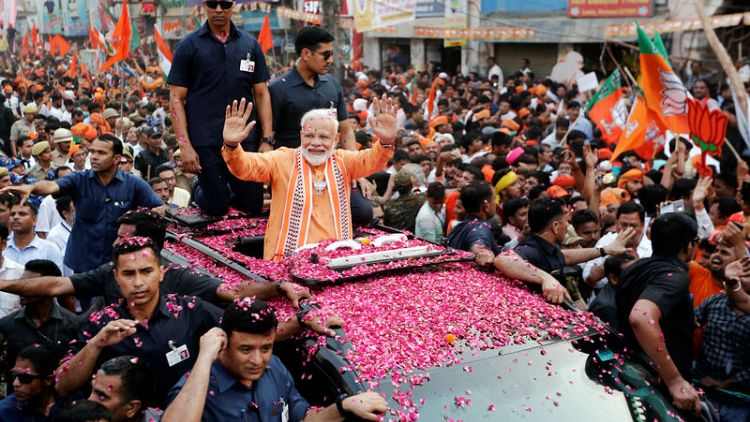 Huge crowds greet India's Modi in his sacred city seat