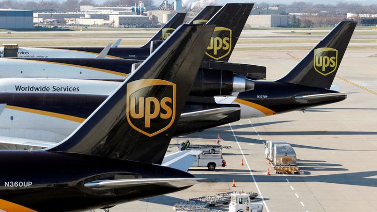 UPS profit hurt by severe weather, issues disappointing outlook for second quarter; shares sink