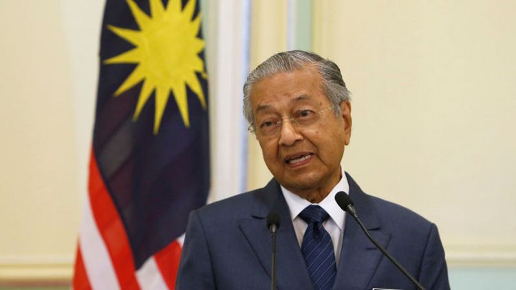 Support for Malaysian PM drops as concerns grow over economy, race - survey