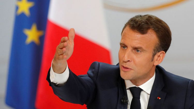 Macron's move to scrap elite school alarms powerful alumni network