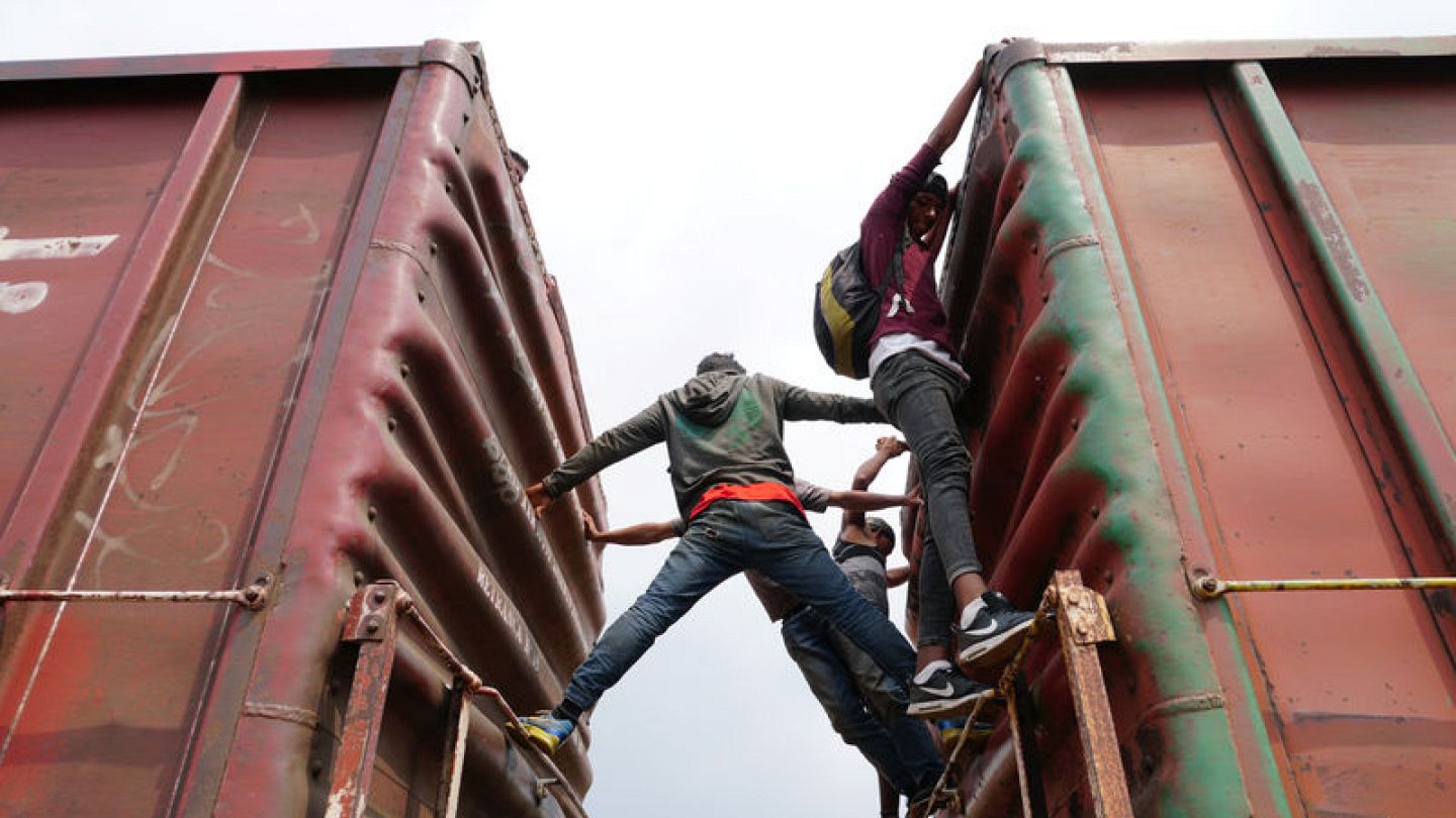 Hundreds of migrants in southern Mexico board 'The Beast' heading north