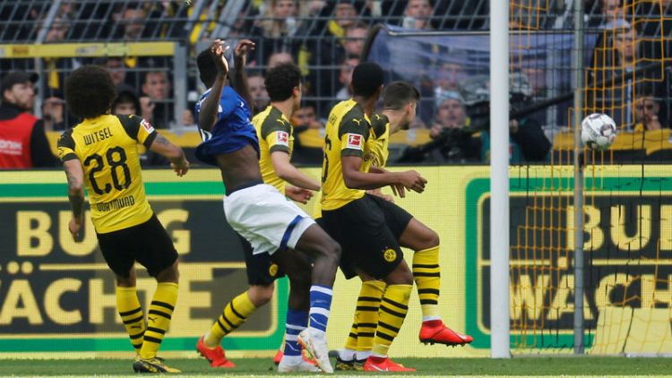 Dortmund's title hopes dented by shock home loss to Schalke