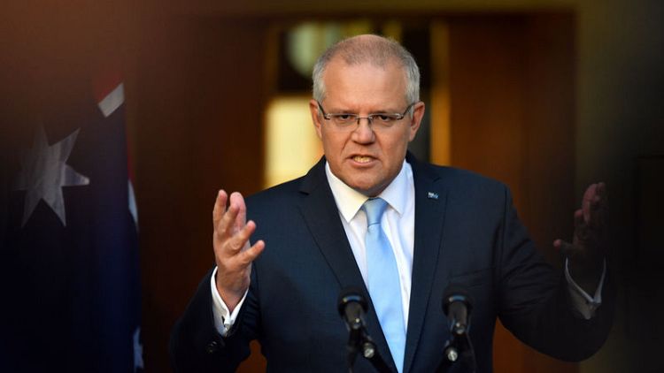 Australian PM clashes with rival in feisty debate as poll tightens