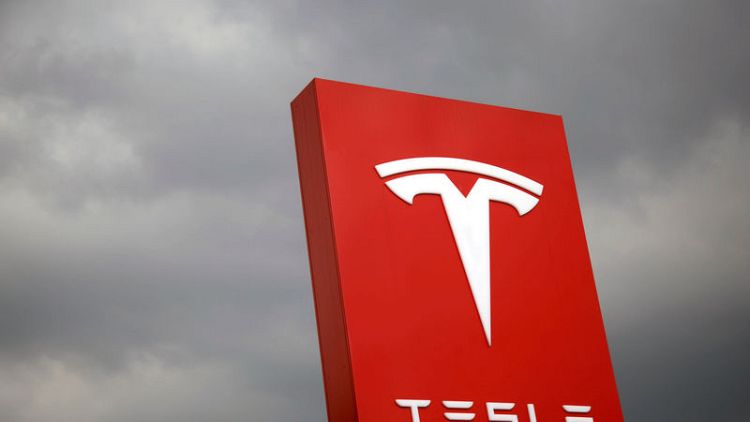 Tesla says may seek new funding; shares up after SEC agreement