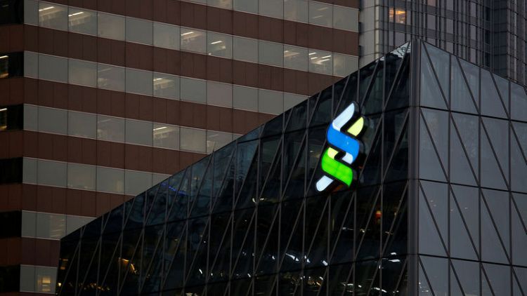 Standard Chartered flags turnaround progress with $1 billion buyback plan, shares rise