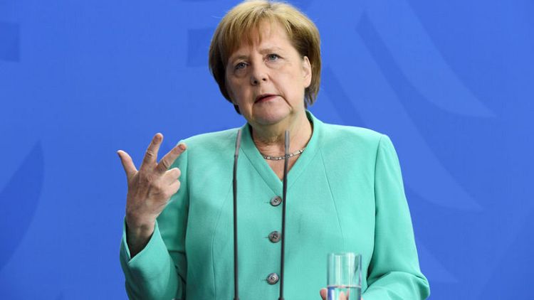 Germany's Merkel rejects speculation about early exit