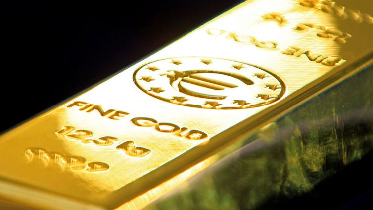 الذهب يهبط لأدنى مستوى في أسبوع مع تعافي الدولار بعد بيان مجلس الاحتياطي