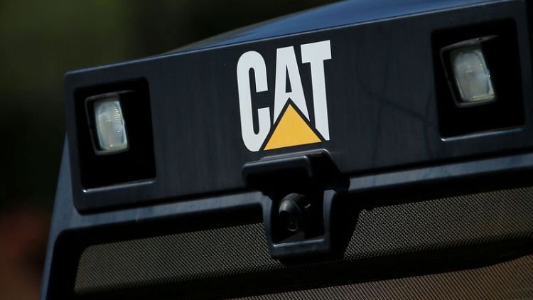 Caterpillar expects to raise dividend, buy back shares over next four years