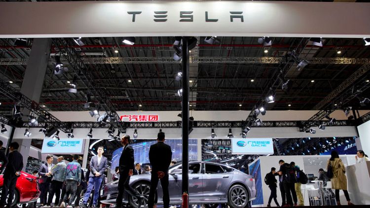 Tesla raises size of share sale, Musk to buy more