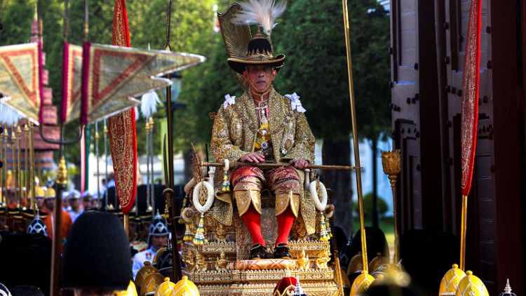 Newly crowned Thai king carried through Bangkok in royal procession