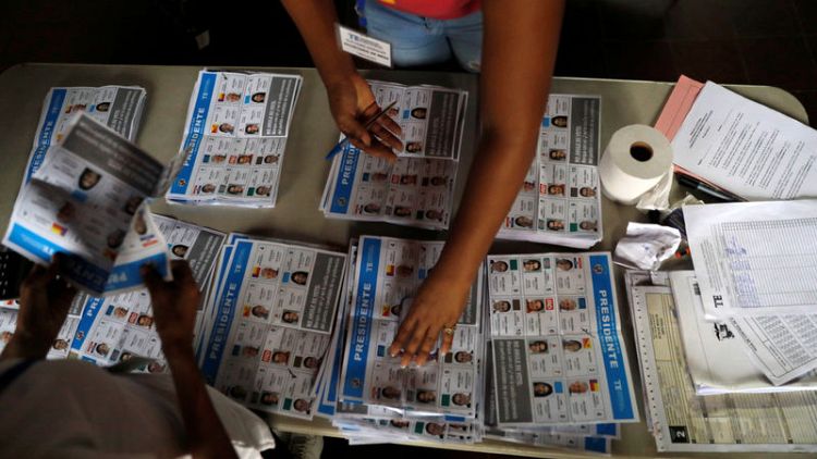Panama presidential candidate Cortizo holds narrow lead with half the votes counted