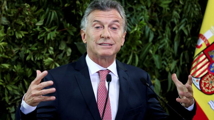 Argentina's Macri seeks accord with rivals to calm volatile markets