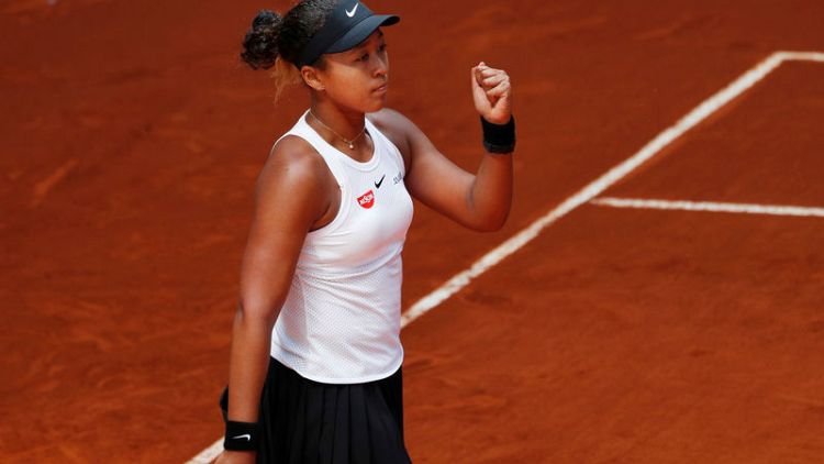 Osaka survives test to reach last 16 in Madrid along with Halep