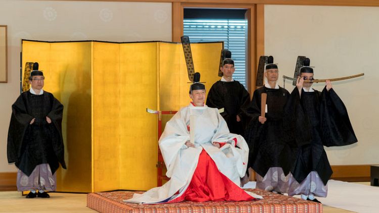 Donning elaborate robes, Japan's new imperial couple hold Shinto rite