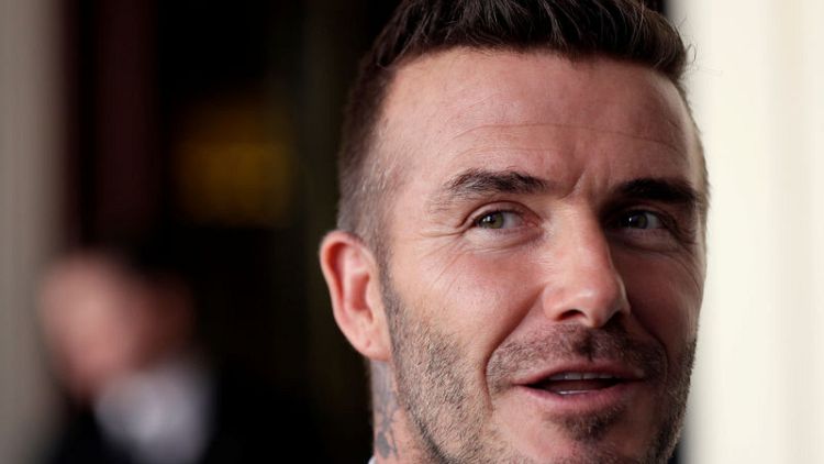 David Beckham gets six-month driving ban for using phone at wheel - BBC