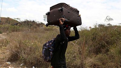 Venezuela reopens border where migrants used trails to reach Brazil Venezuela reopens border where migrants used trails to reach Brazil