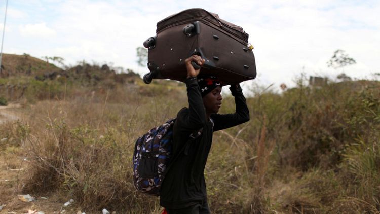 Venezuela reopens border where migrants used trails to reach Brazil
