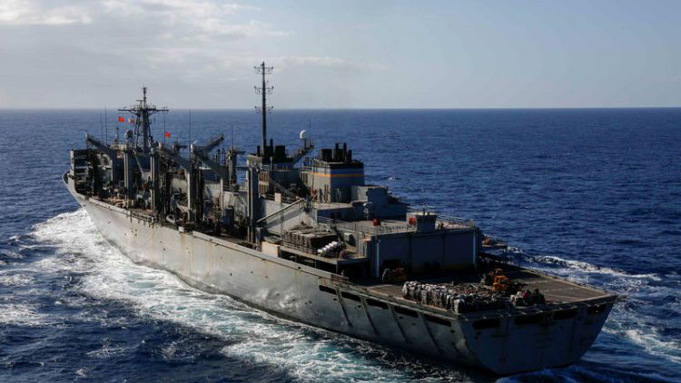 U.S. warns merchant ships of possible Iranian attacks; cleric threatens U.S. fleet