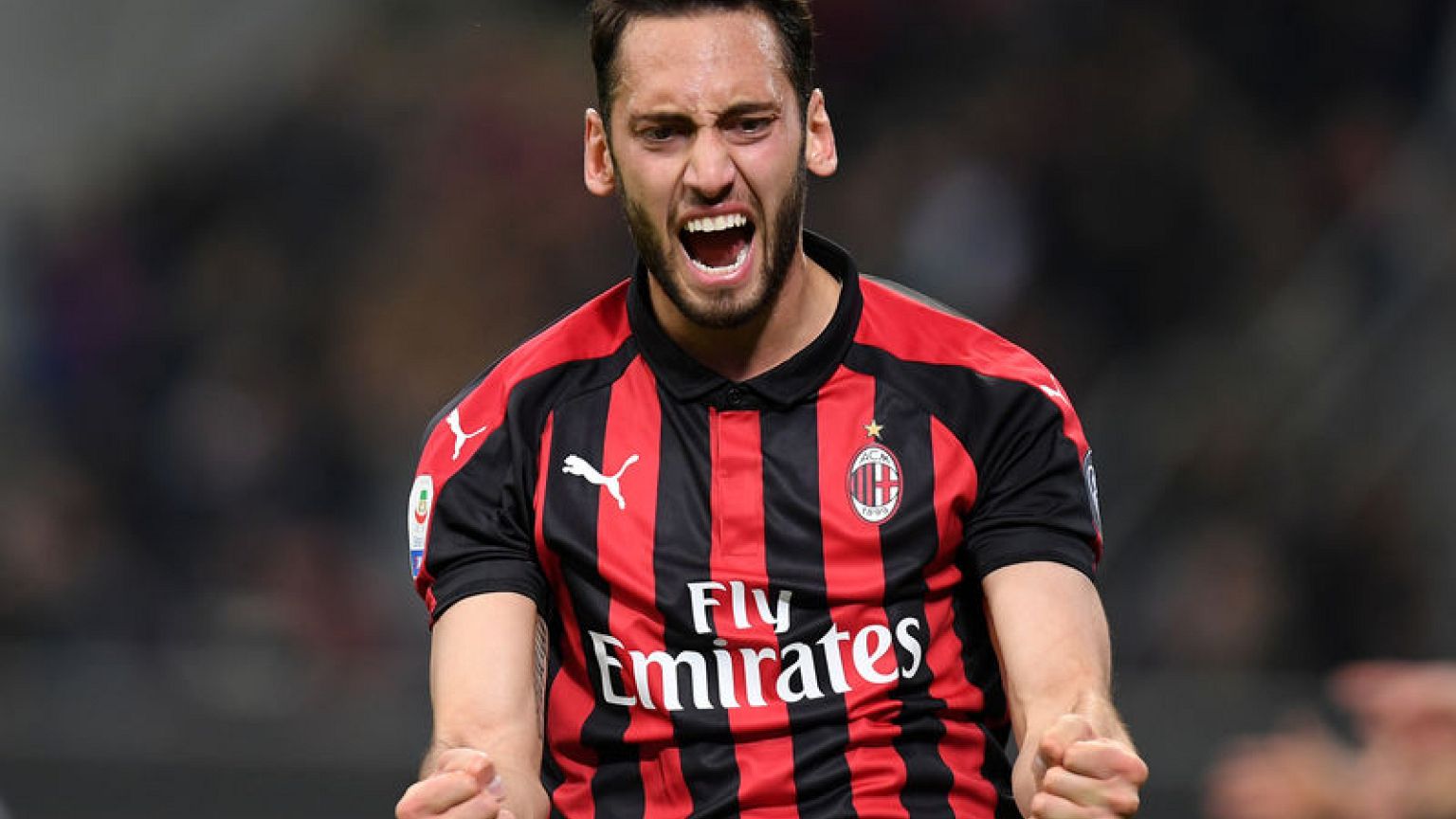 Rare Calhanoglu goal keeps Milan in Champions League hunt