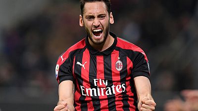 Rare Calhanoglu goal keeps Milan in Champions League hunt Rare Calhanoglu goal keeps Milan in Champions League hunt