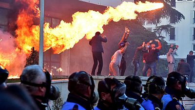 Albanian protesters hurl petrol bombs, seek snap polls Albanian protesters hurl petrol bombs, seek snap polls