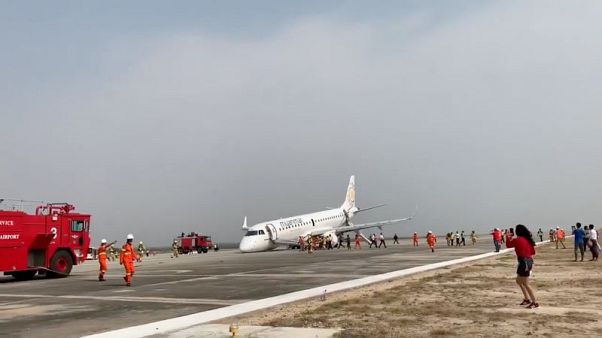 Myanmar pilot safely lands plane on its nose after landing gear failure Myanmar pilot safely lands plane on its nose after landing gear failure