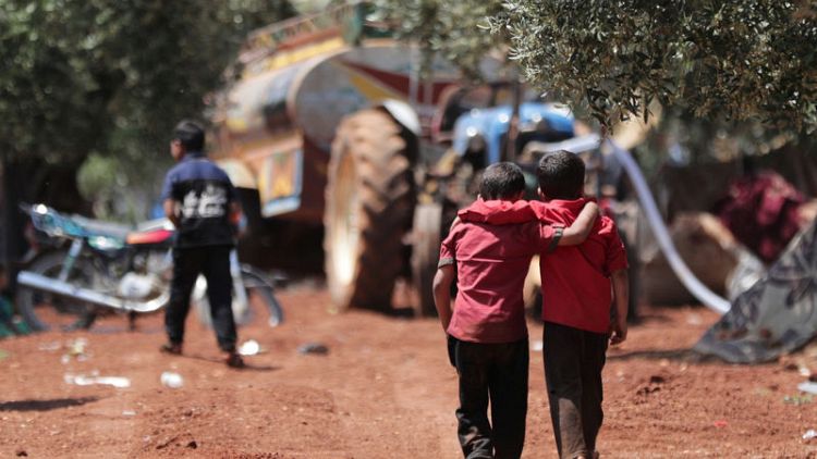 After fleeing bombs, Syrian families shelter in olive groves