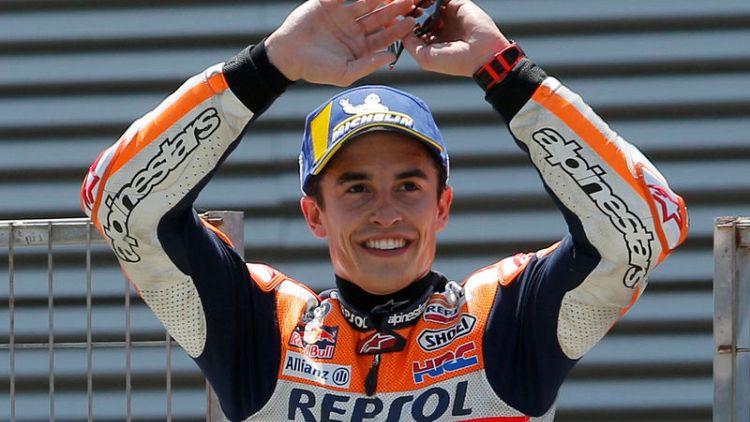 Motorcycling - Marquez braves wet conditions to take pole in France