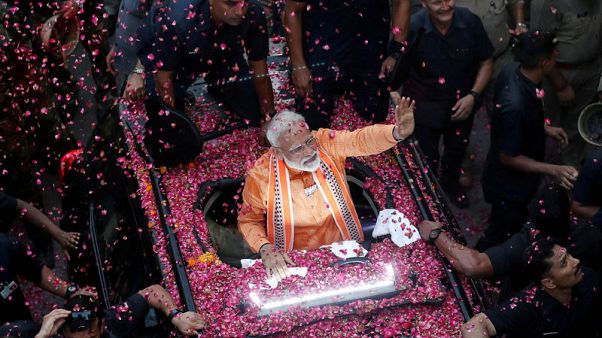 India's Modi set to sweep election, exit polls show India's Modi set to sweep election, exit polls show