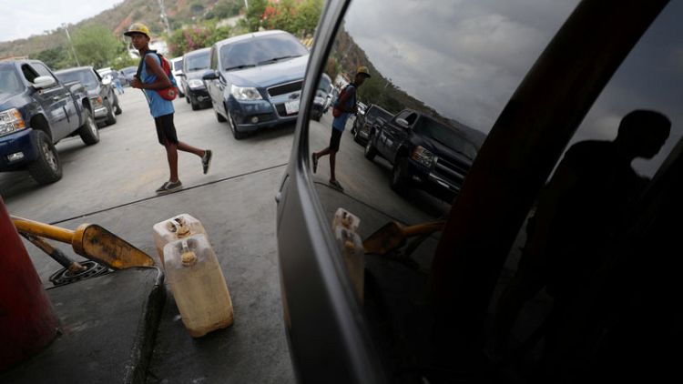 Soldiers oversee fuel rationing in some Venezuelan towns amid shortages