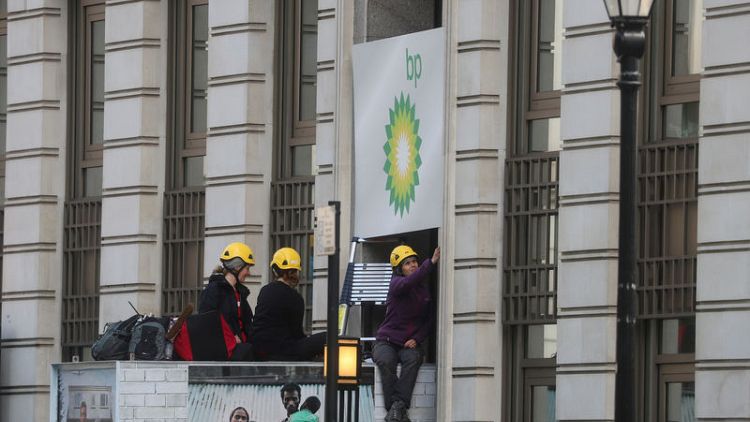 Greenpeace activists block BP London HQ demanding end to oil exploration