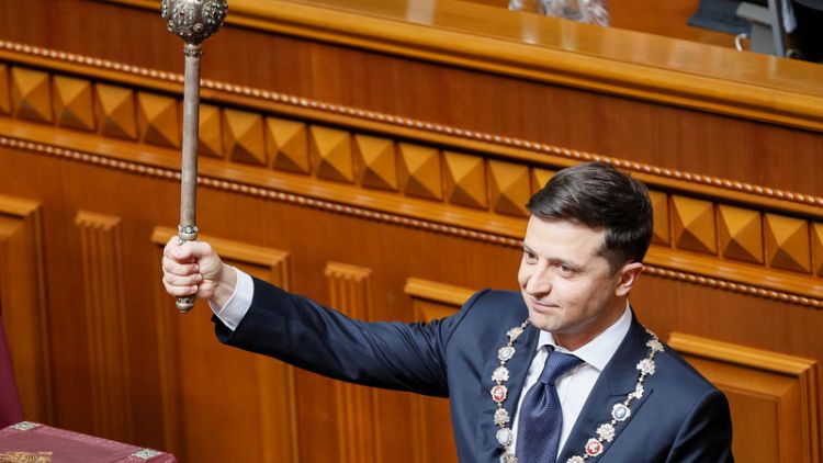 High fives, selfies and a snap election as Zelenskiy takes power in Ukraine