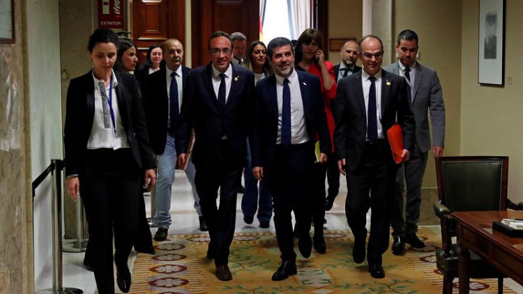 Jailed Catalan separatist MPs pick up credentials amid tight security