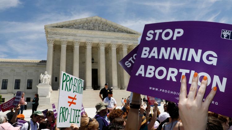 Hundreds rally at U.S. Supreme Court, calling state abortion bans as step backward