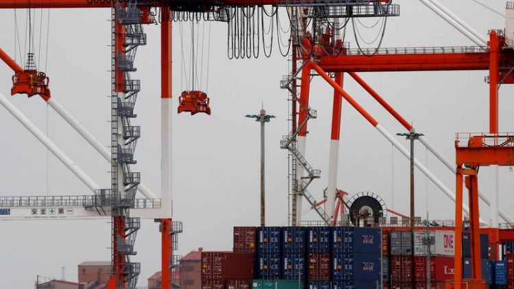 Japan exports fall again but business sentiment offers hope