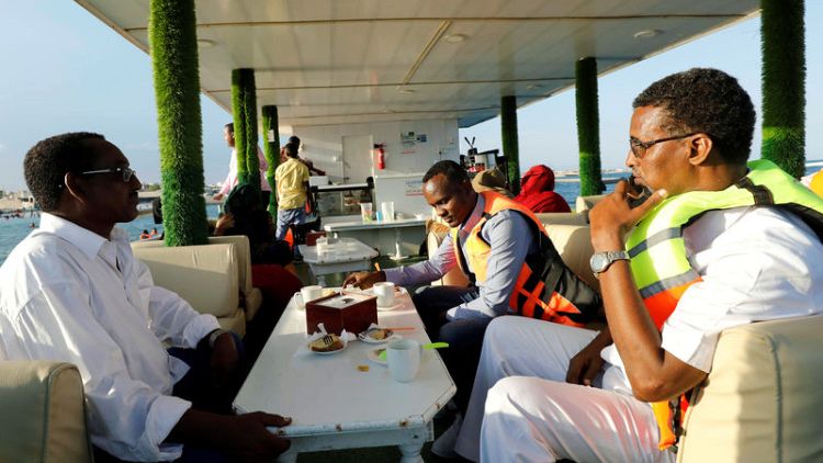 Somalis escape to the beach and a new floating restaurant
