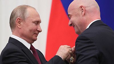 Putin honours FIFA's Infantino with state medal over 2018 World Cup