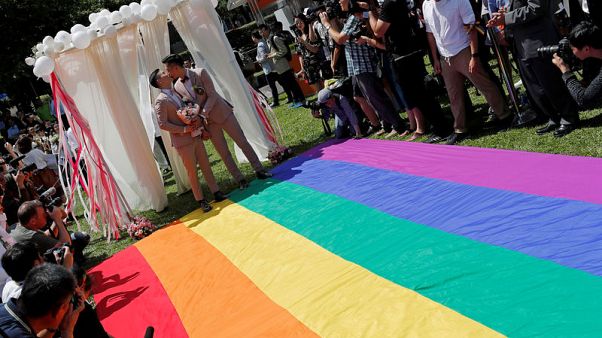 Taiwan celebrates Asia's first same-sex marriages as couples tie knot Taiwan celebrates Asia's first same-sex marriages as couples tie knot