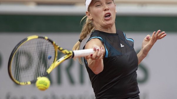 Fragile Wozniacki another top casualty in Paris Fragile Wozniacki another top casualty in Paris