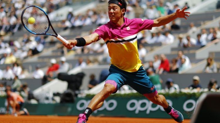 Nishikori downs Tsonga to reach French Open third round