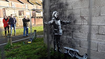 Banksy ash mural moved from garage to gallery in Welsh town