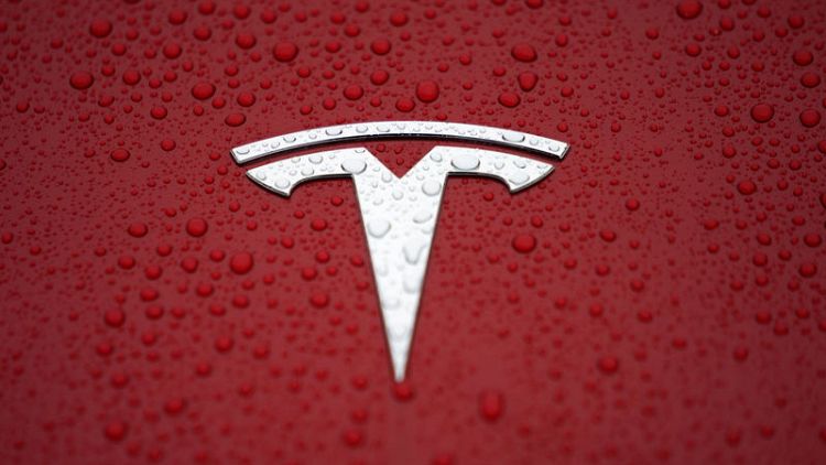 Tesla CEO urges employees to 'catch up' to hit delivery record